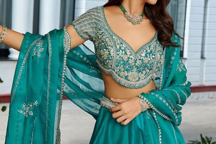 https://setmywed.com/blogs/wp-content/uploads/2023/11/Buy-Green-Mulberry-Silk-Embroidery-Floral-Leaf-Neck-Lehenga-Set-For-Women-by-Osaa-by-Adarsh-Online-at-Aza-Fashions_.jpeg